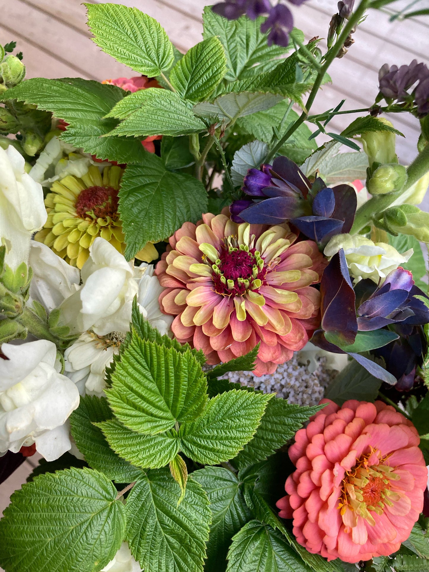Bouquet of colorful flowers with green leaves